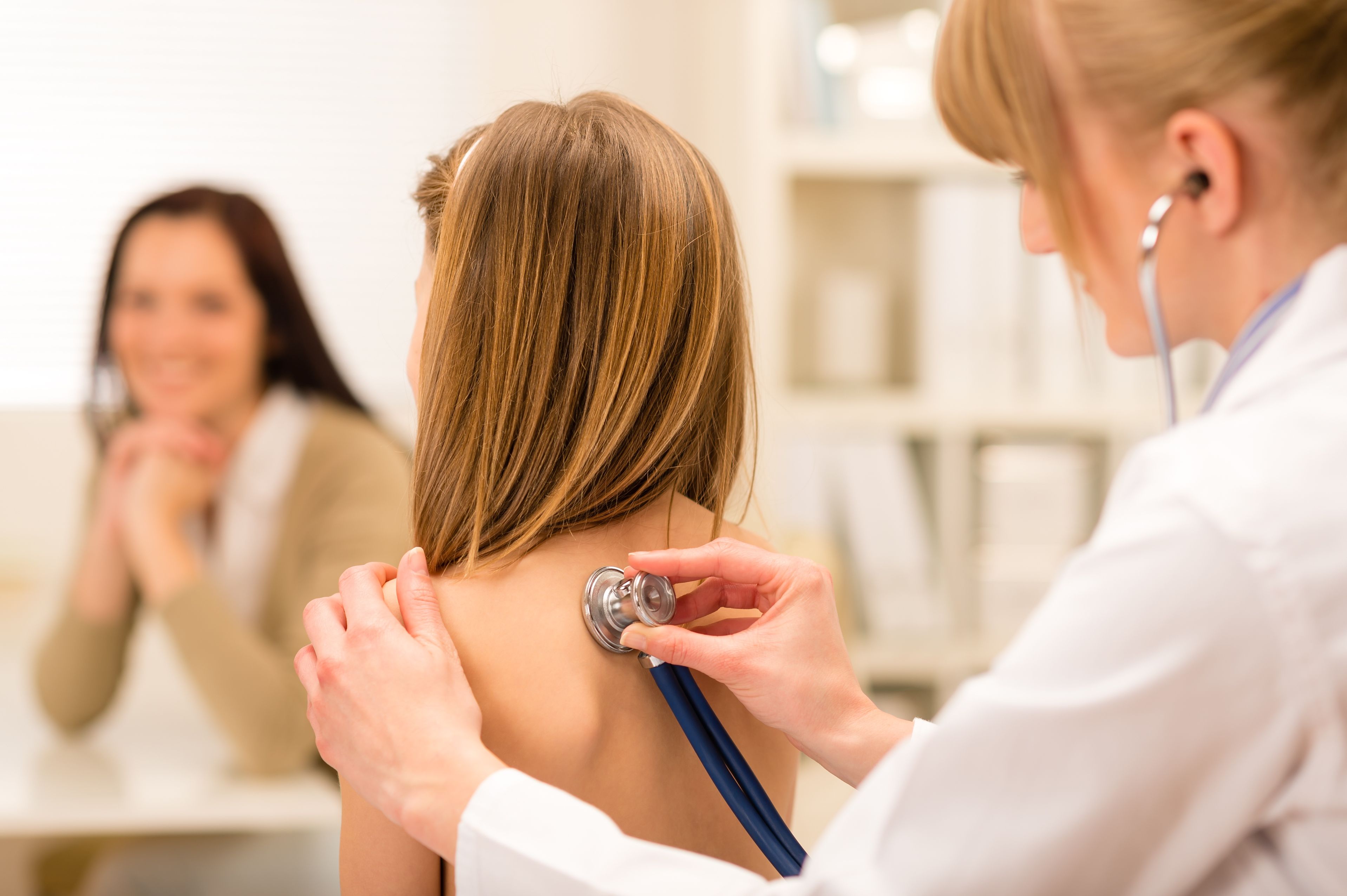 girl being examine with stethoscope by pediatrician – Settlement Health