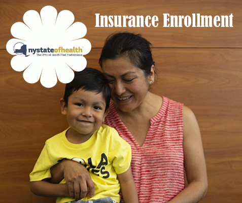 Mom holds smiling child with sign above head that reads insurance enrollment
